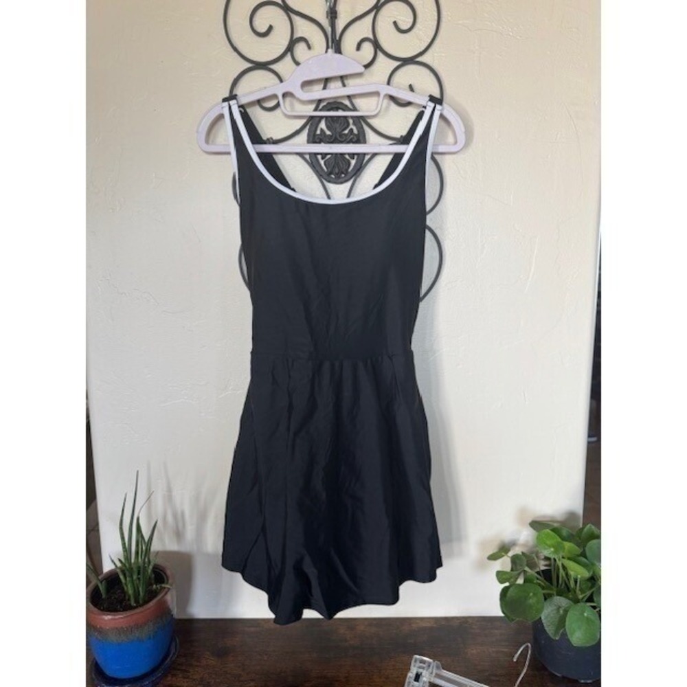 New without tags Black swim dress with built in shorts Size M